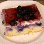 full blueberry tres leches cake in dish