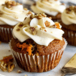 Carrot cupcake with cream cheese frosting and chopped pecans