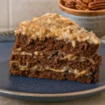 Slice of German chocolate cake recipe with coconut pecan frosting layers
